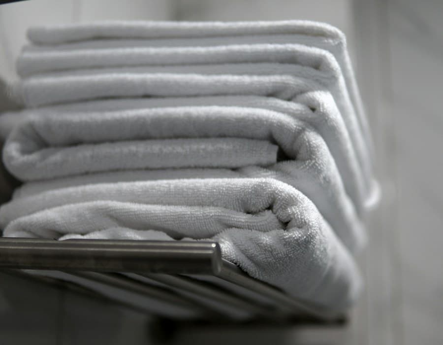 Stacked folded towels on rack